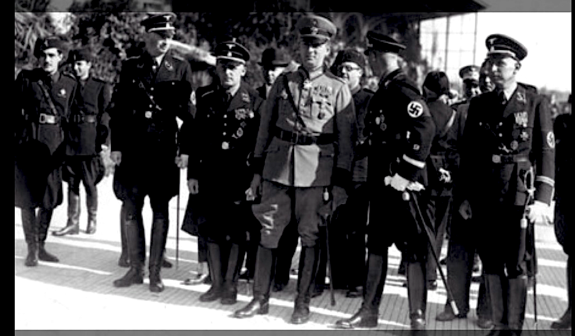 Troligen Rom 1938. Müller var kort, kanske inte som man skulle förvänta sig av en SS-general. Möjligen Hudal diagonalt bakom till höger i bilden.